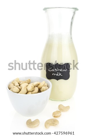 Cashew milk and cashews,  on white background
