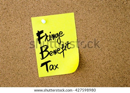 Business Acronym FBT Fringe Benefit Tax written on yellow paper note pinned on cork board with white thumbtack, copy space available