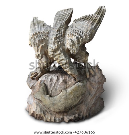 Eagles are catching salmon eat art carved from oak, old, ancient isolated on white background. This has clipping path.