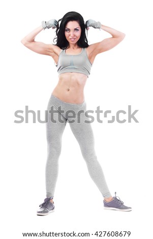 fitness woman in sport style standing against white background. isolated