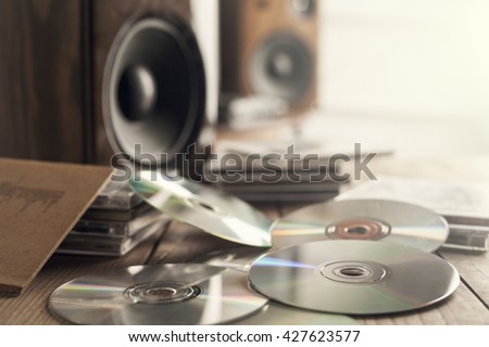 Rows of music cds with speakers Royalty-Free Stock Photo #427623577