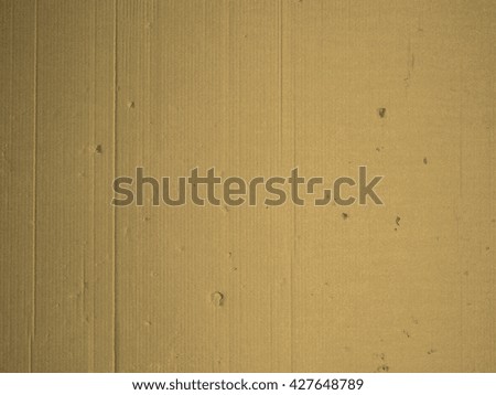 Brown corrugated cardboard packaging useful as a background vintage sepia