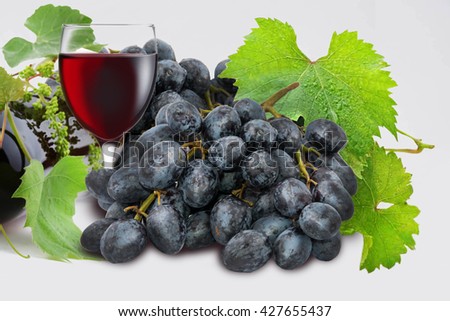Mixed Fruit, Orange, apple, Bunch of red , Black and green  grapeson a white background, Closeup
