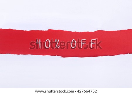 Torn paper with a 40% OFF word on red background.