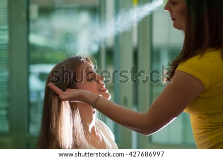 Stylist make haircut,under exposed photo