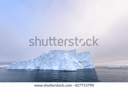 There is a big iceberg on the picture, all glaciers are melting onnorth pole.