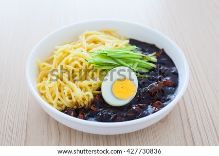 Korean black bean sauce noodles Jajangmyeon on wood table Royalty-Free Stock Photo #427730836