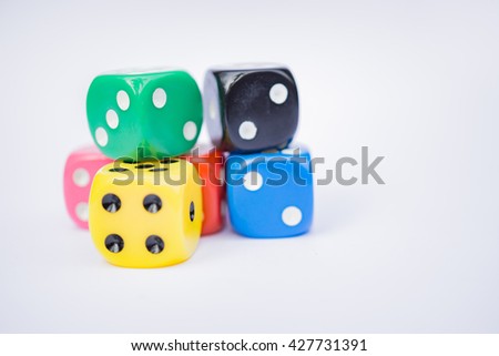 Colorful dices, Business risk by rolling the dice concept, chance, good luck or gambling isolated