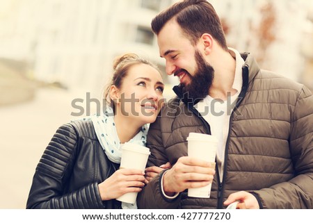 Picture of young couple on a date with coffee