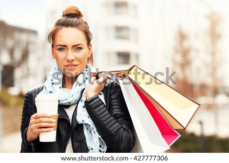 Picture of young woman with shopping bags