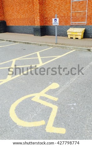 Disabled car parking space in a shopping mall car park, UK