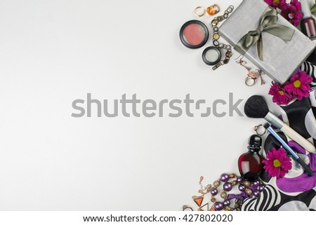 Women's accessories and cosmetics. Top view photo of colorful and glamour objects with free space for logo