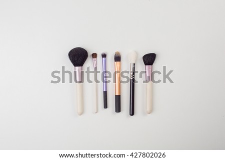 Women's makeup brushes. Top view photo of glamour professional makeup brushes