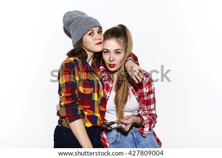  lifestyle selfie portrait of two young positive woman having fun and making selfie, teenage hipster trendy clothes , fresh make up. happy together. sisters, friends.  girlfriends 
