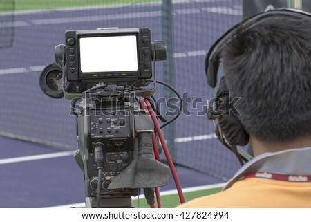 video recording the tennis game at tennis competitive fields Royalty-Free Stock Photo #427824994