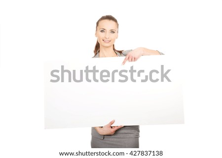 Business woman presenting empty banner.