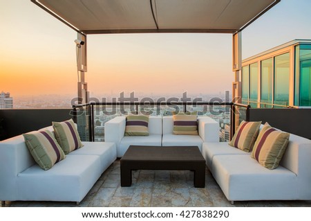 Relax coner on condominium roof top garden with sofa and table