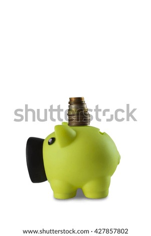 Pink piggy bank with coins on white a background.