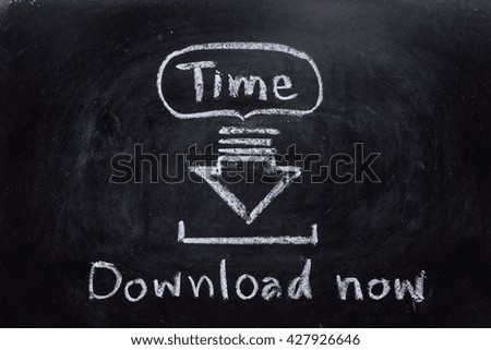 time downloading writing with down sign arrow drawn with chalk on blackboard.