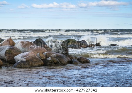 Sea waves breaking on the rocks, seascape