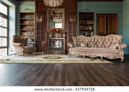 Luxury interior of home library. Sitting room with elegant furniture Royalty-Free Stock Photo #427934728