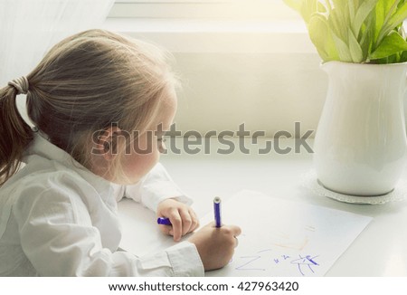 Creativity concept. Little girl drawing