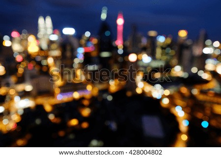 Blur image of Kuala Lumpur city skyline at Night.