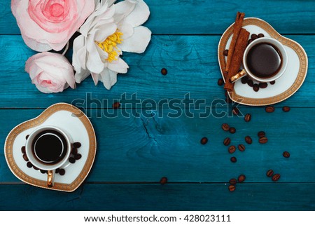 cup coffee on saucer in form of heart and flowers