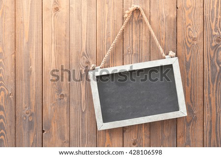 blank blackboard on wooden wall background