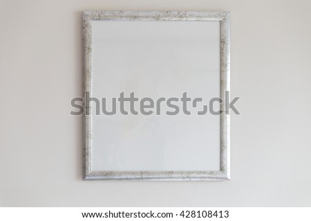 silver picture frame decorating on white wall