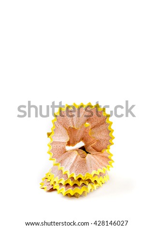 Yellow pencil shavings isolated on white. Vertical image.