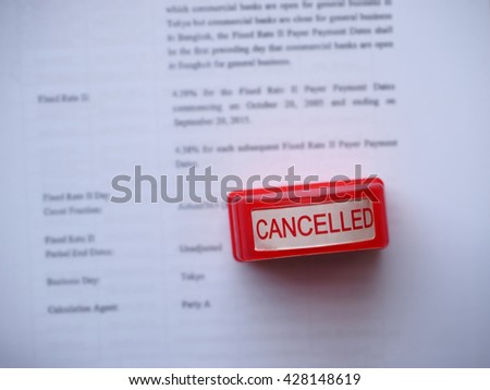 The cancelled rubber stamp on blurred financial document