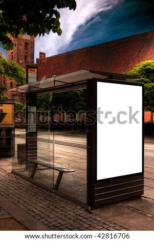 A high dynamic range image of a bus stop with a blank bilboard for your advertising