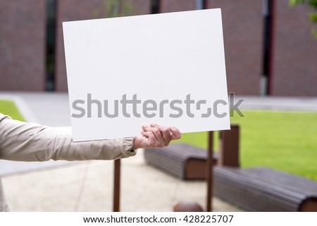 photo of a woman on the outside with an empty white card