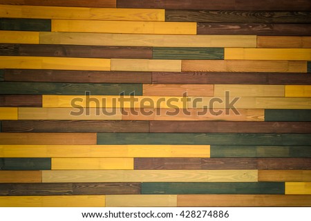 Colorful wooden wall made of different types of wood, pine, oak, maple, spruce. All boards of different colors Photography can be used for textures and backgrounds in a variety of image editors