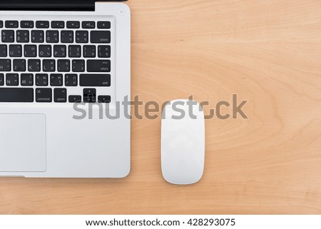 Laptop and mouse from top view