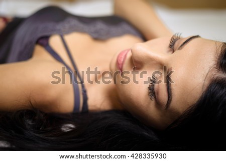 Portrait of sleeping beautiful lady in bed background, black white picture