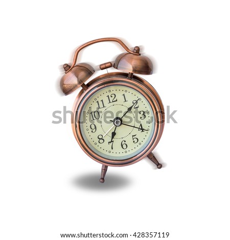 vintage alarm clock ringing and vibrating in the morning,wake up concept