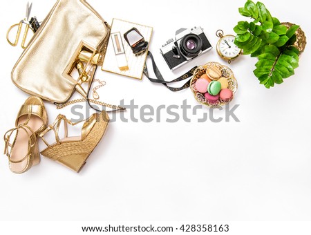 Flat lay for social media fashion bloggers. Feminine accessories, bag, shoes, vintage no name photo camera on white background
