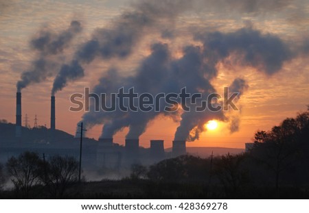 Factory pipe polluting air against sunset, environmental problems, smoke from chimneys Royalty-Free Stock Photo #428369278