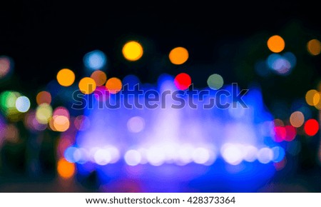 Abstract Blurred background image of Fountain with night light bokeh .