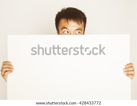pretty cool asian man holding empty white plate smiling