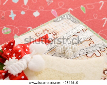 christmas card decorated with bell and snowflake