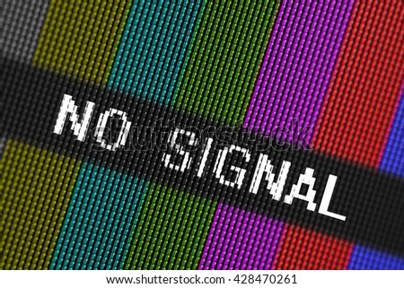 Closeup pixels of LCD TV screen with color bars and message no signal is a television test pattern