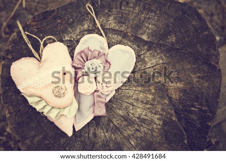 Hand-made hearts  on the old board