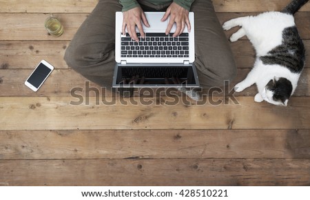woman behind laptop computer with her cat. Header image