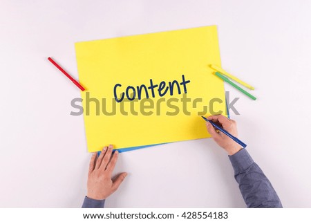 Hand writing Content Management System on yellow paper