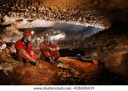 Cavers exploring a beautiful cave Royalty-Free Stock Photo #428600659