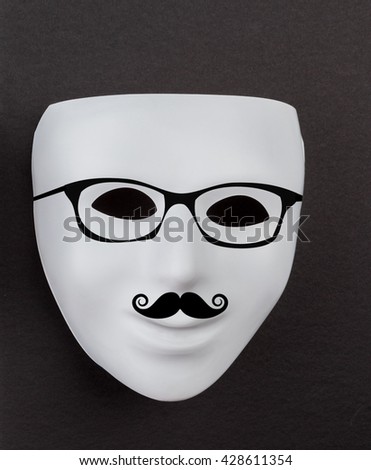 White mask on black background with hipster glasses and mustache.