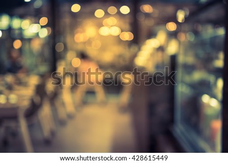 blurred image of coffee shop with bokeh, vintage color